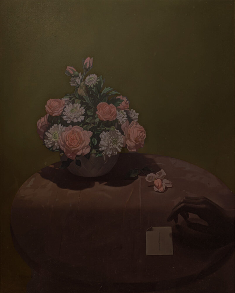 still life of flowers and hand holding note