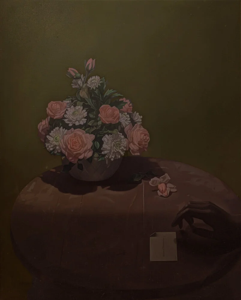Still life of flowers and hand holding note