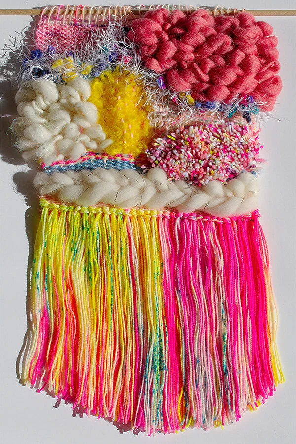 Pink and yellow colored woven tapestry made out of wool and cotton