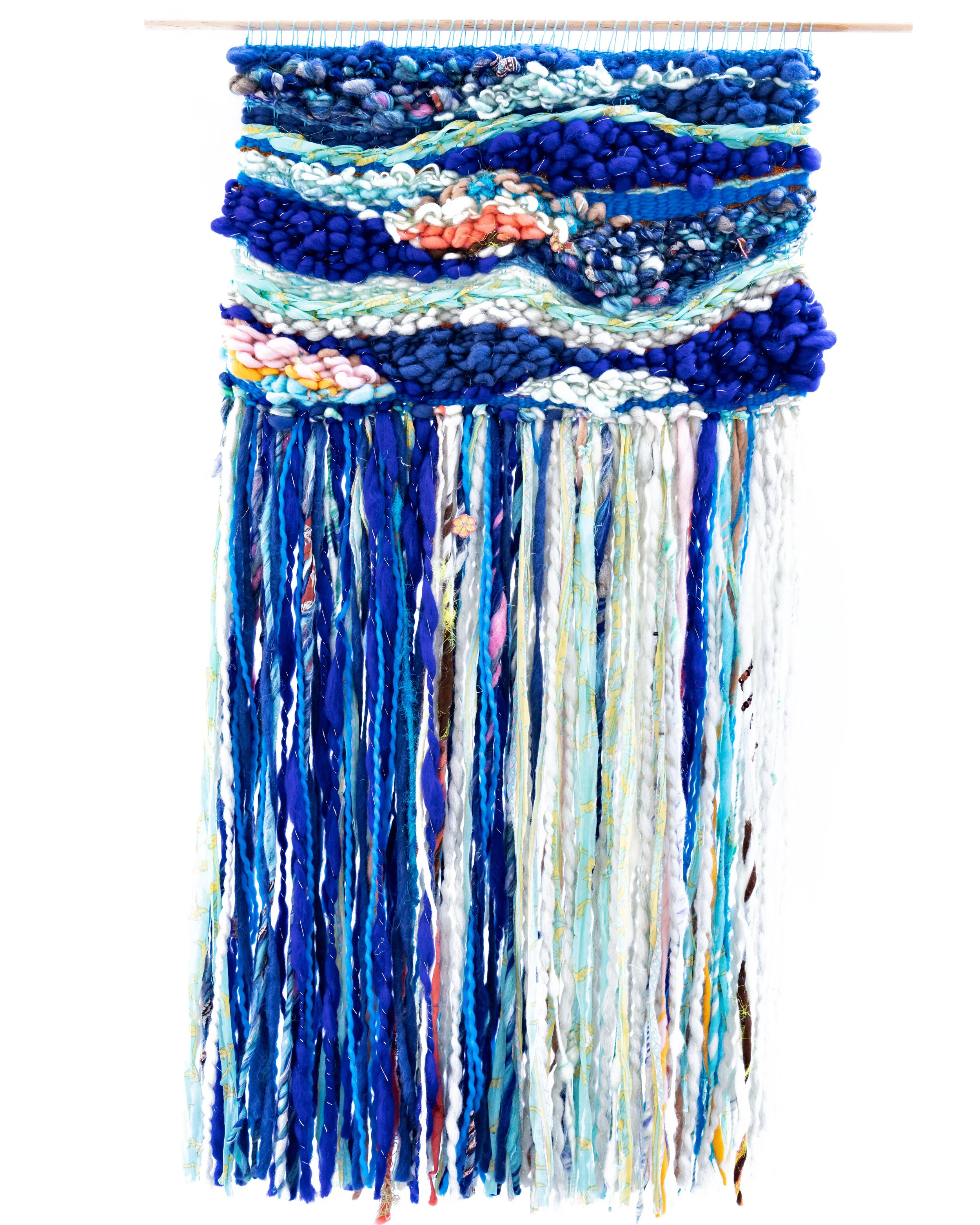 Pink and yellow colored woven tapestry made out of wool and cotton