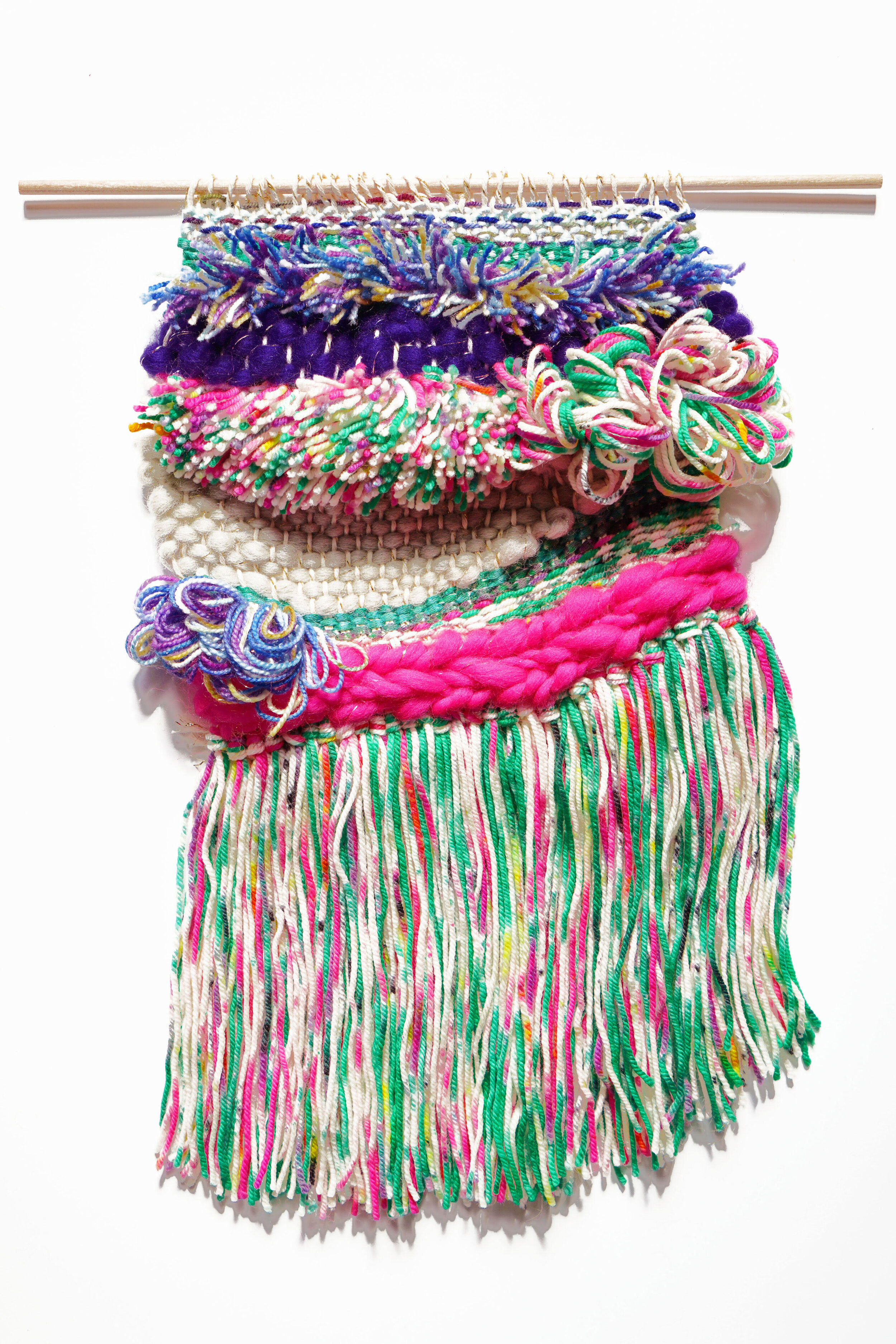 Pink and yellow colored woven tapestry made out of wool and cotton