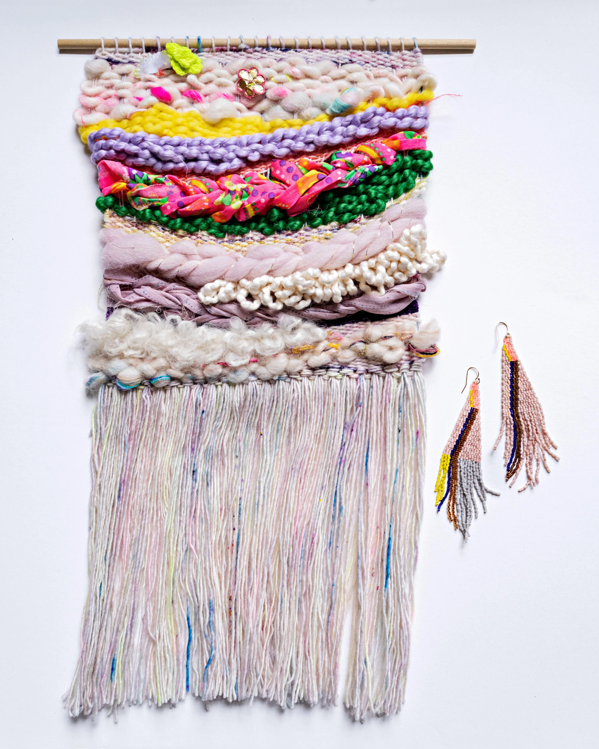 Pink and yellow colored woven tapestry made out of wool and cotton