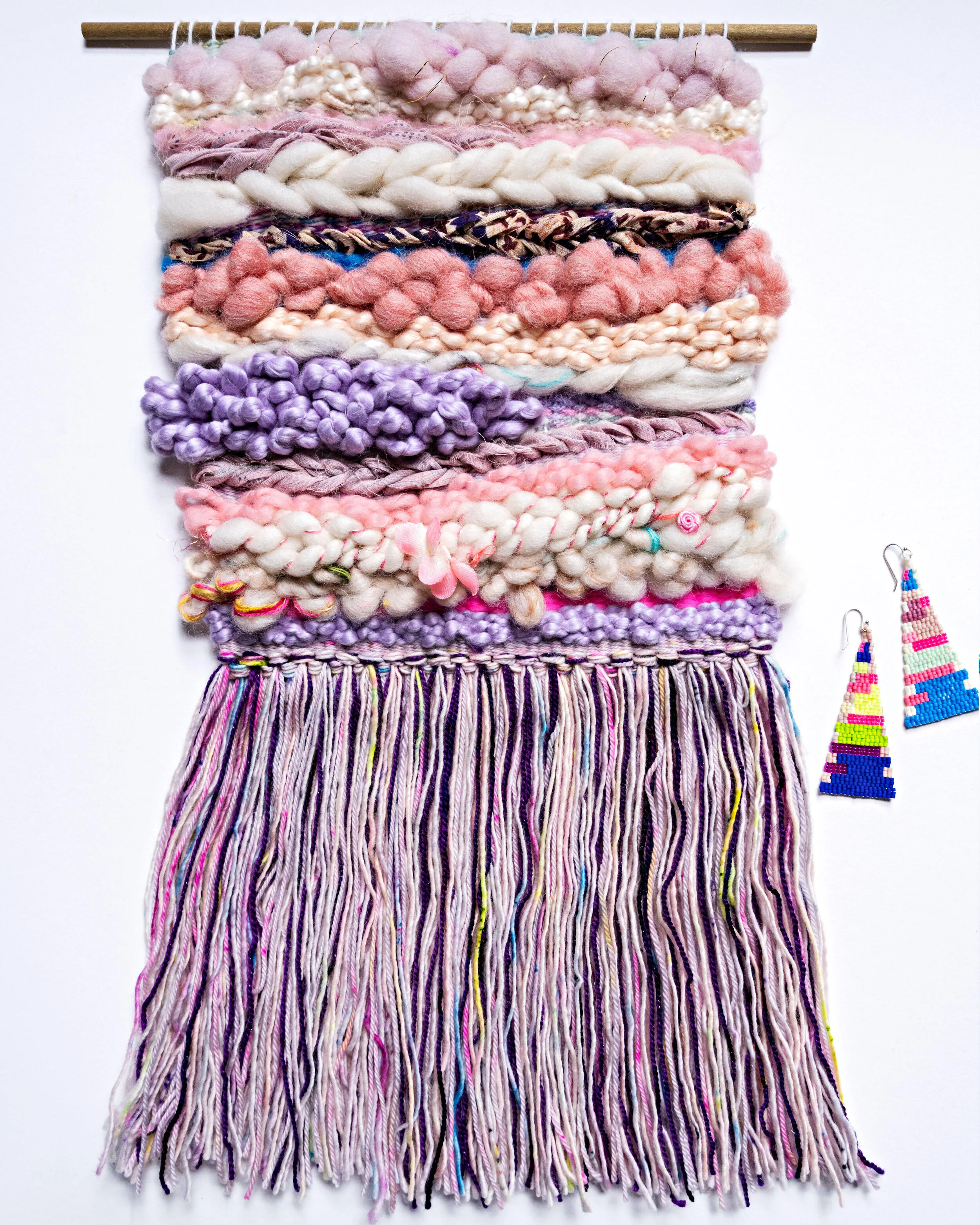 Pink and yellow colored woven tapestry made out of wool and cotton