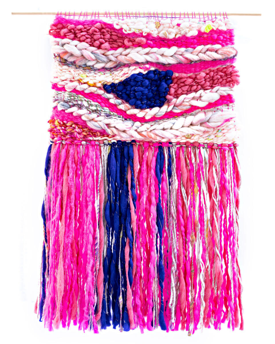wool and cotton tapestry in pinks, white and blue