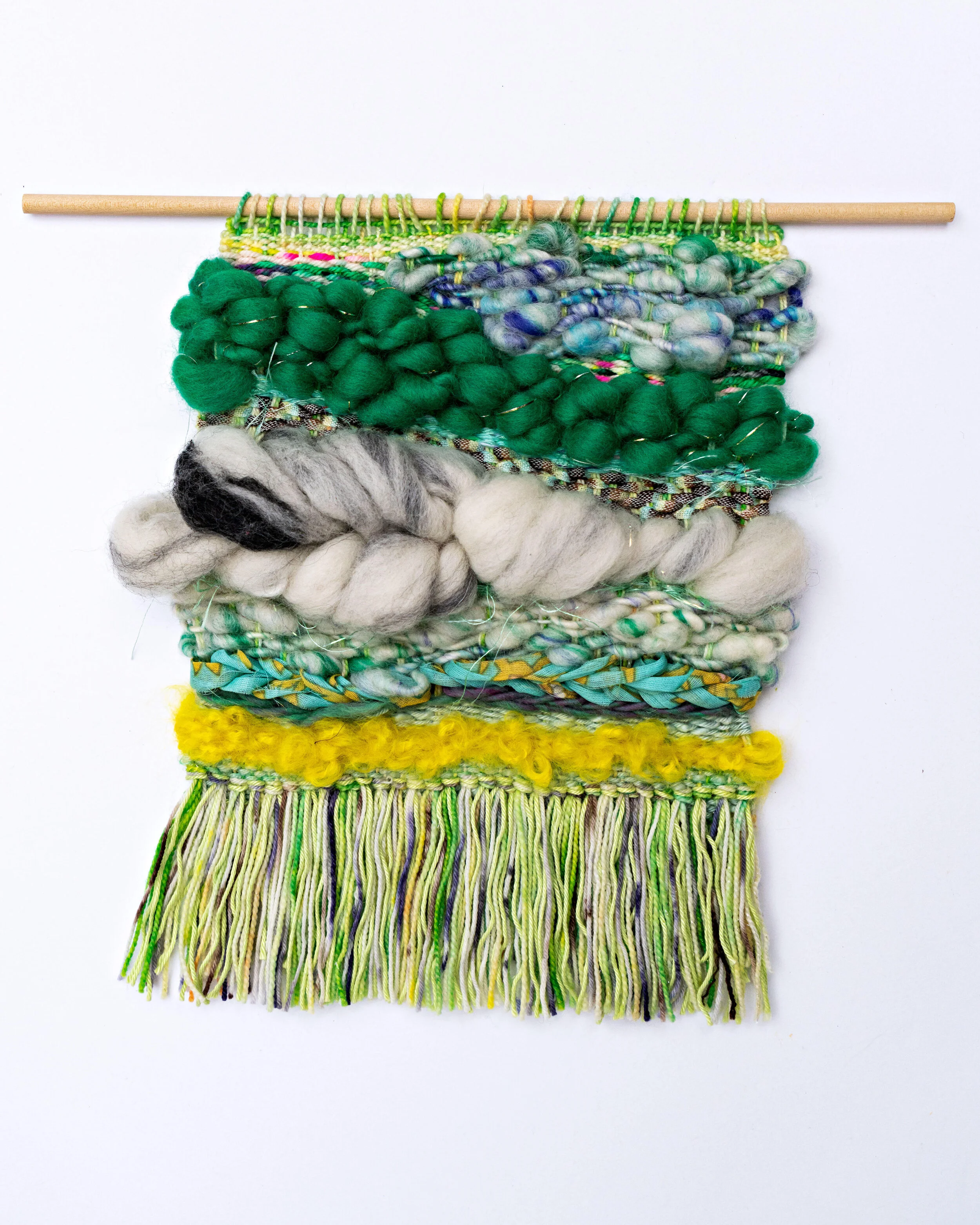 Wool and cotton woven tapestry in different shades of green