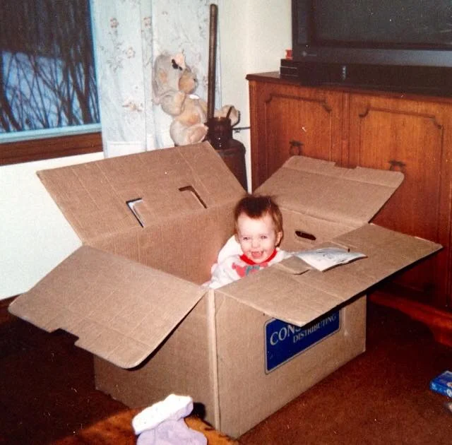 Paige's first Christmas at my parents' place. My dad owned the Consumers in Guelph so there were plenty of these boxes hanging around over the years. Man, I loved that store!