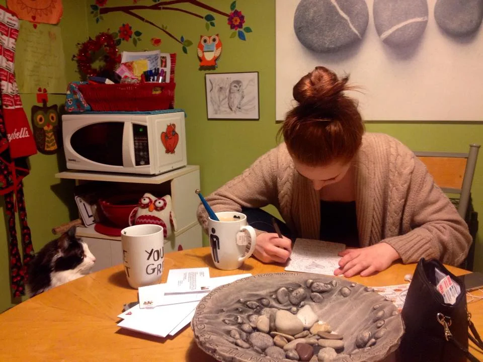 Chloe intently watching Paige create.