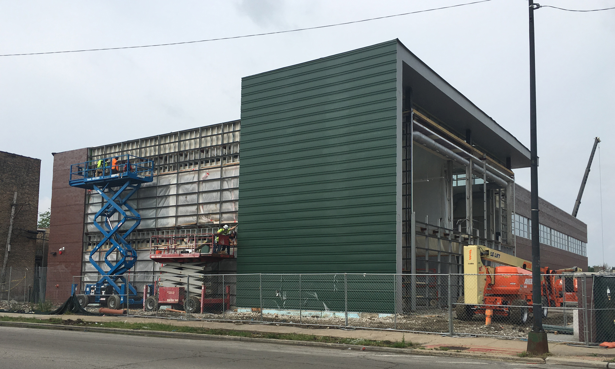 UCAN NEW OFFICES Glazing in progress for the large curtain walls for the lobby and meeting spaces at UCAN 's new location.