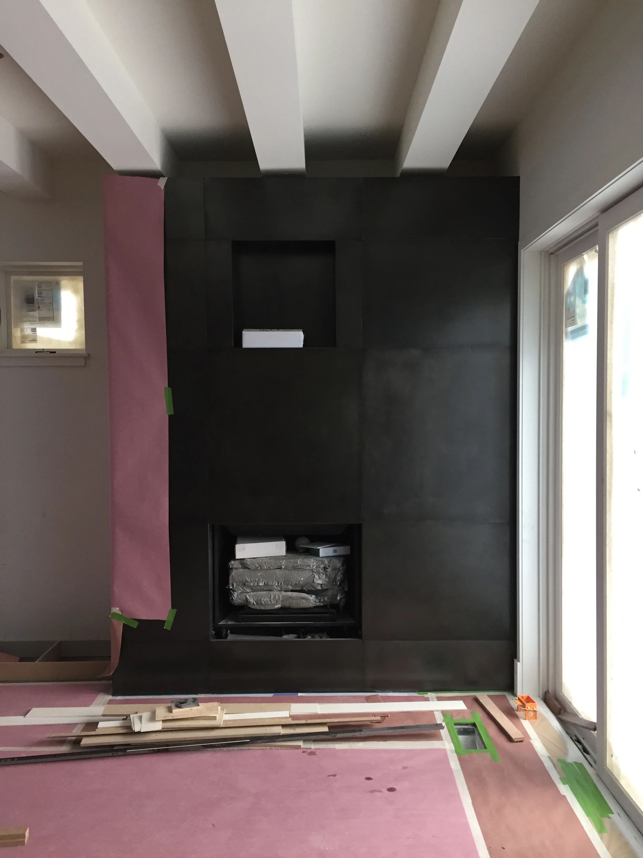 HERMITAGE FIREPLACE FRAMED Fireplace finishing touches with blackened steel panels; both enticing and durable.