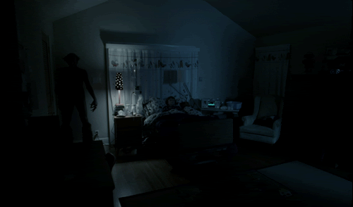 The Demon gesturing towards Dalton as he sleeps.