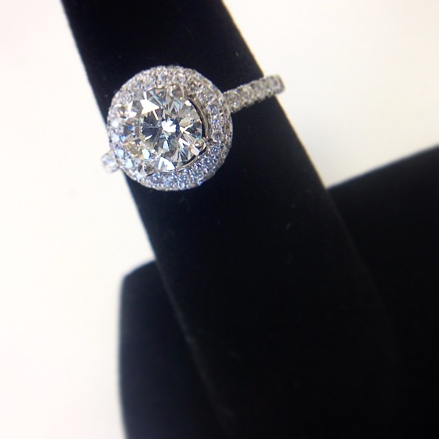 Ohh what a pleasant change from all those big rocks! A simple pav&eacute; halo setting for a 1ct round center... She's going to love it!