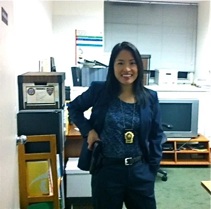 Sue w:gun and badge.jpg