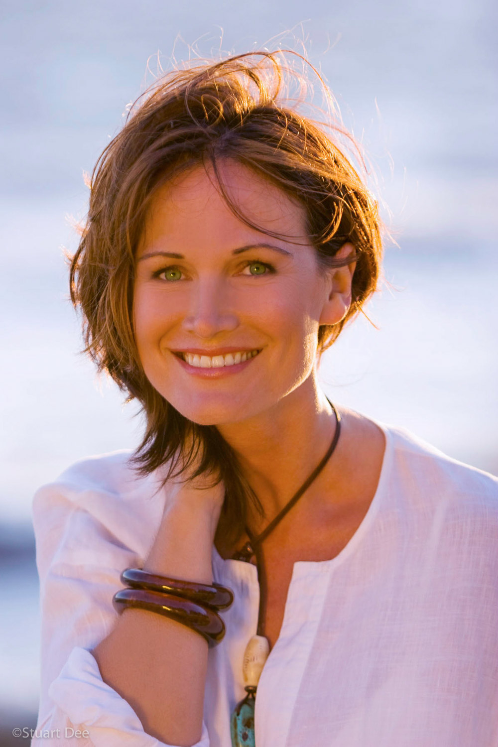  Woman, portrait, at the beach, with windblown hair 