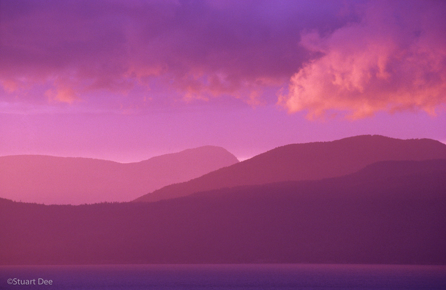  Serene landscape at sunset, showing sea, mountains, and sky, Vancouver, BC, Canada 