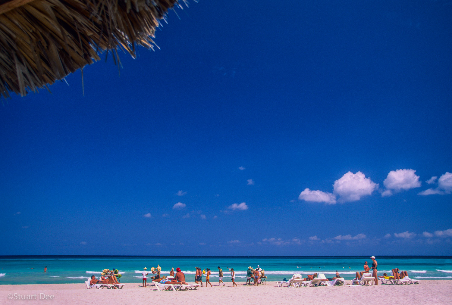  Tourists on beach at resort, Varedero, Cuba 