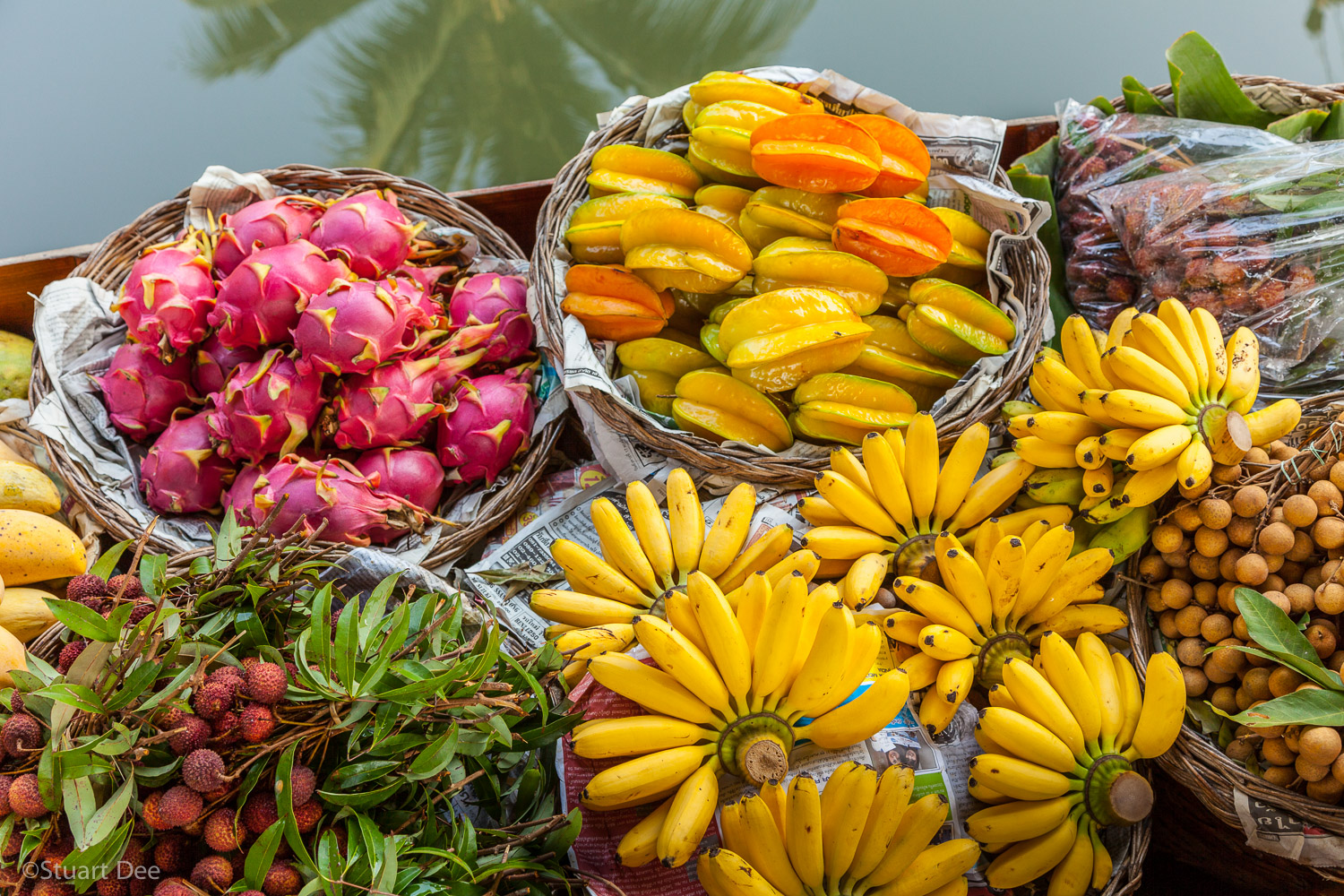  Fresh tropical fruit for sale from boat, floating market, Damnoen Saduak, Ratchaburi, Thailand 