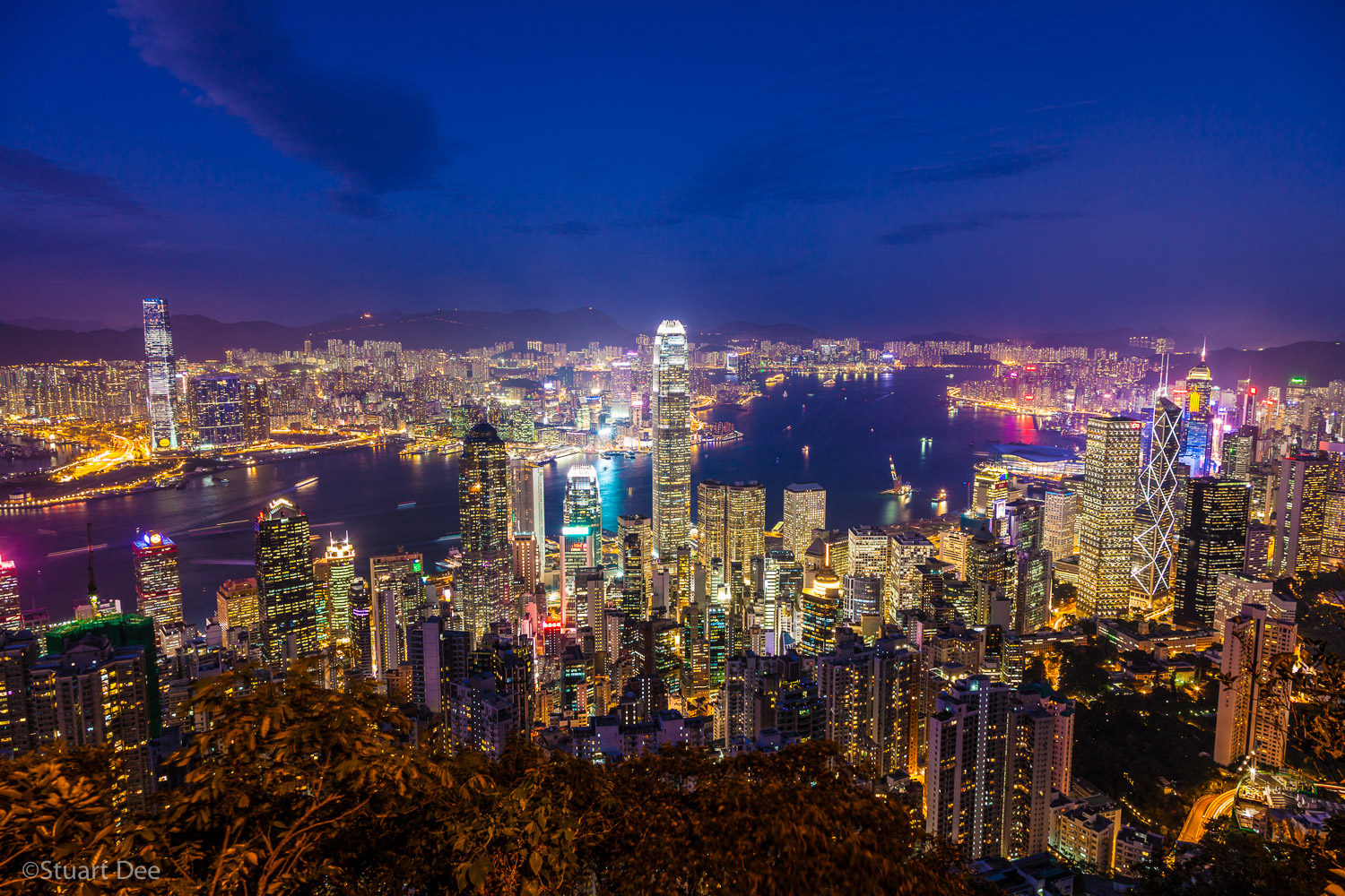  Skyline and Victoria Harbor at dusk/night, Hong Kong, China. 