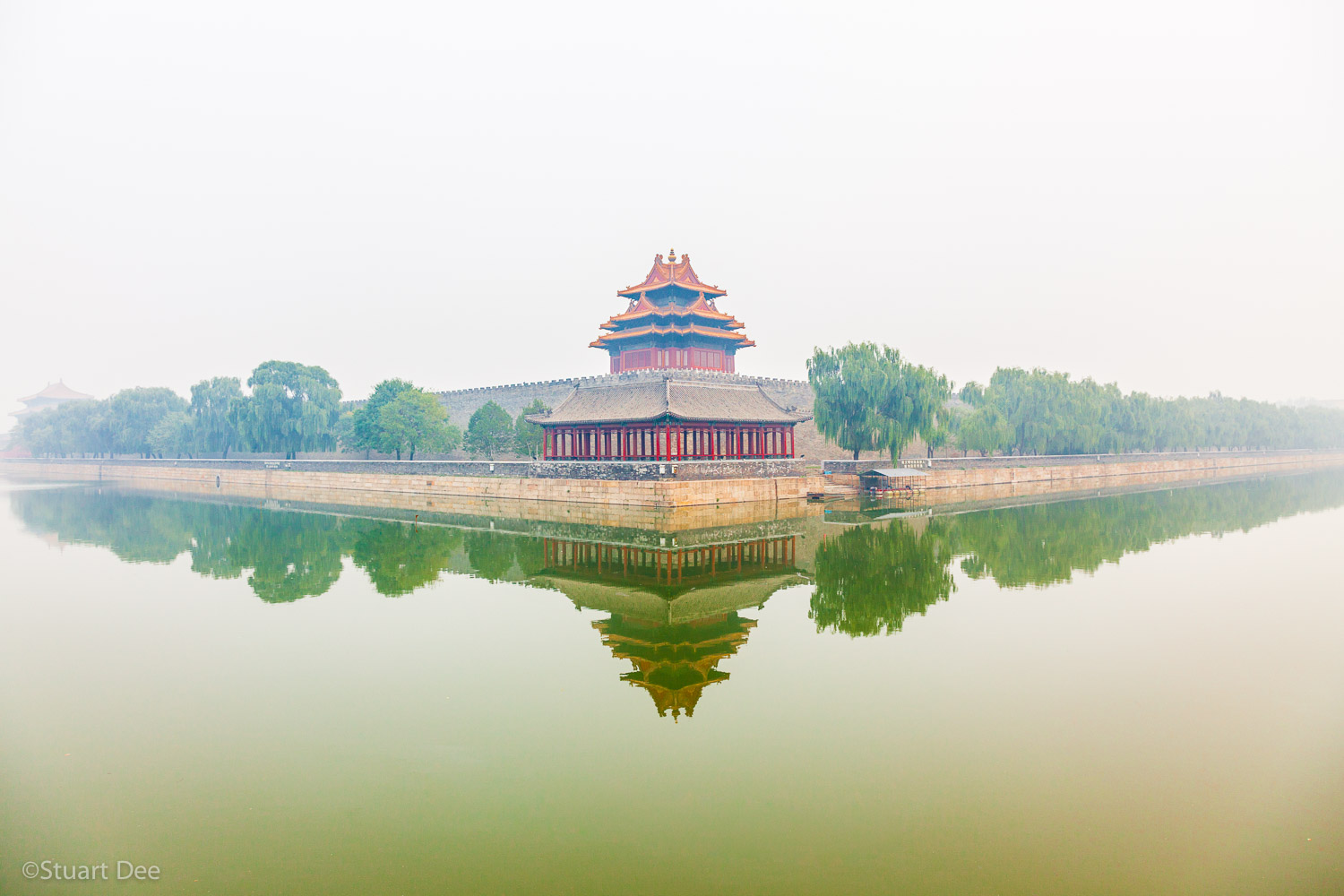  Watchtower of Forbidden city in fog, reflected in moat, Beijing, China 
