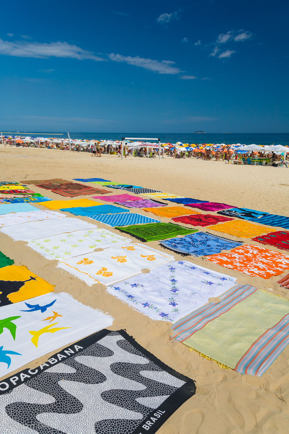  Colorful beach towels on the sand, Ipanema Beach, Ipenema, Rio de Janeiro, Brazil. This beach is one of the most famous in Rio, and was immortalized with the Bossa Nova song "The Girl from Ipanema." 