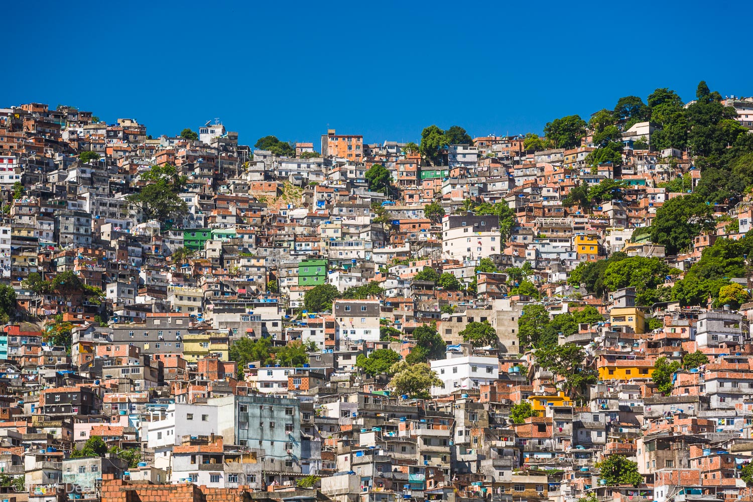  Favela Rocinha, Rio de Janeiro, Brazil. 
Rocinha is the largest and most well known favela in Brazil. It's located within the South Zone of Rio de Janeiro, between the districts of São Conrado and Gávea. Built on a steep hillside overlooking the cit