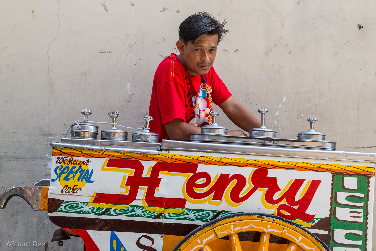  Ice cream vendor, or sorbetero, with traditional hand painted ice cream cart, Manila, Philippines 