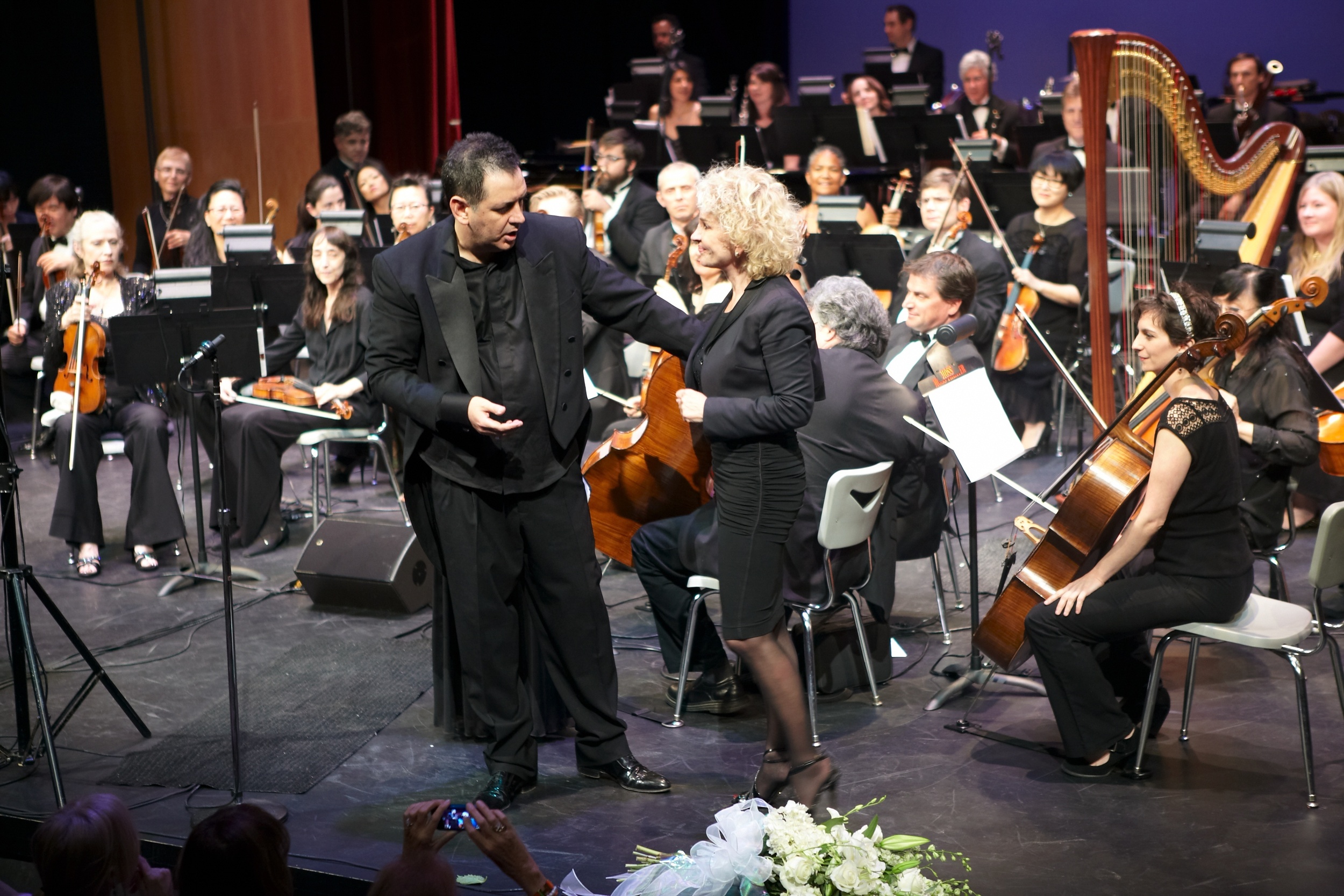 Maestro Andrea Morricone acknowledges concert producer and lyricist Paola Lorenzi. Santa Monica, CA