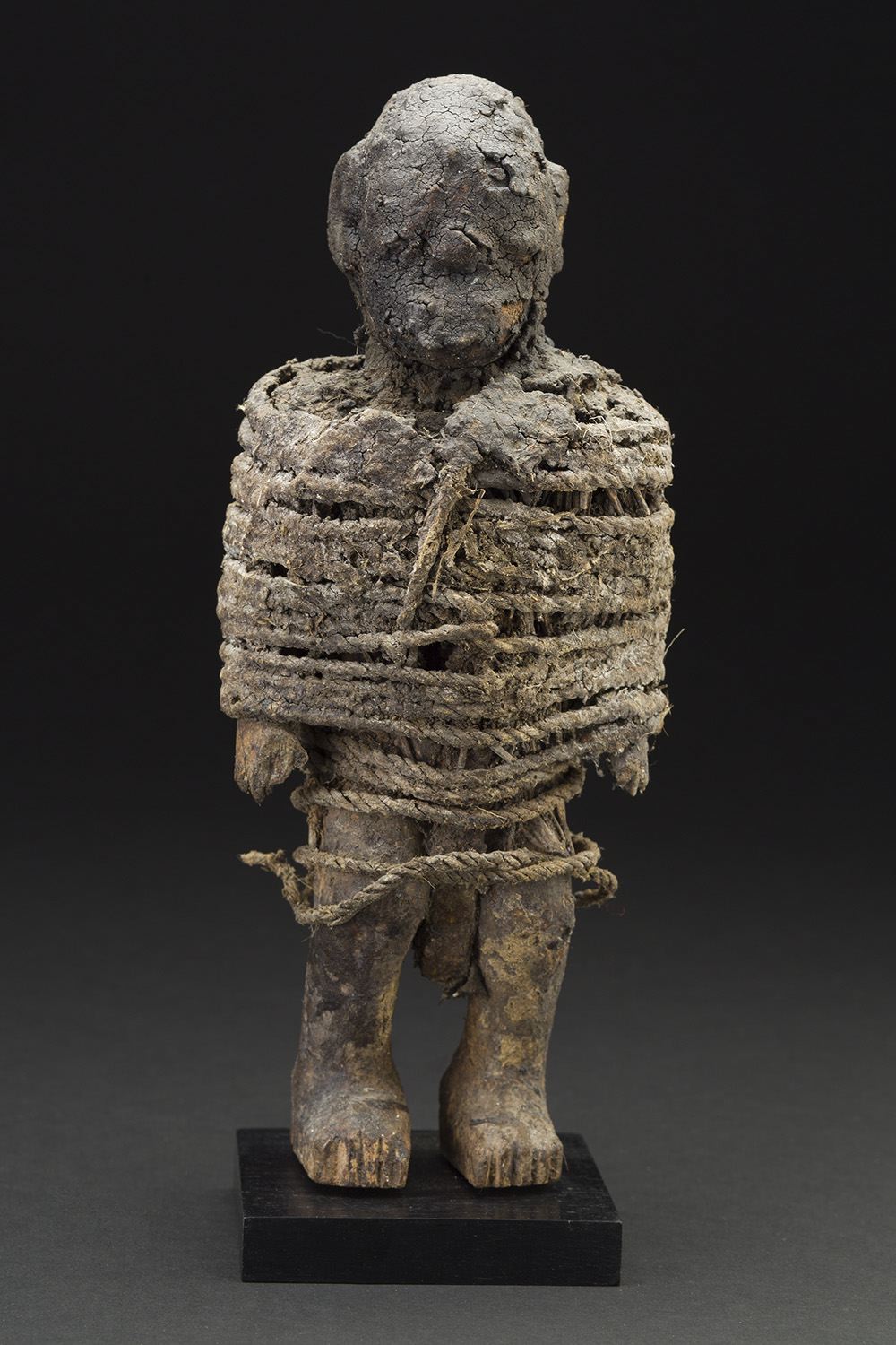   Africa    Vodun Sculpture - Adja People - Benin  , Mid. 20th C. Wood, metal, fiber, sacrificial materials 10.5 x 4 x 3.5 inches 26.7 x 10.2 x 8.9 cm Af 307 