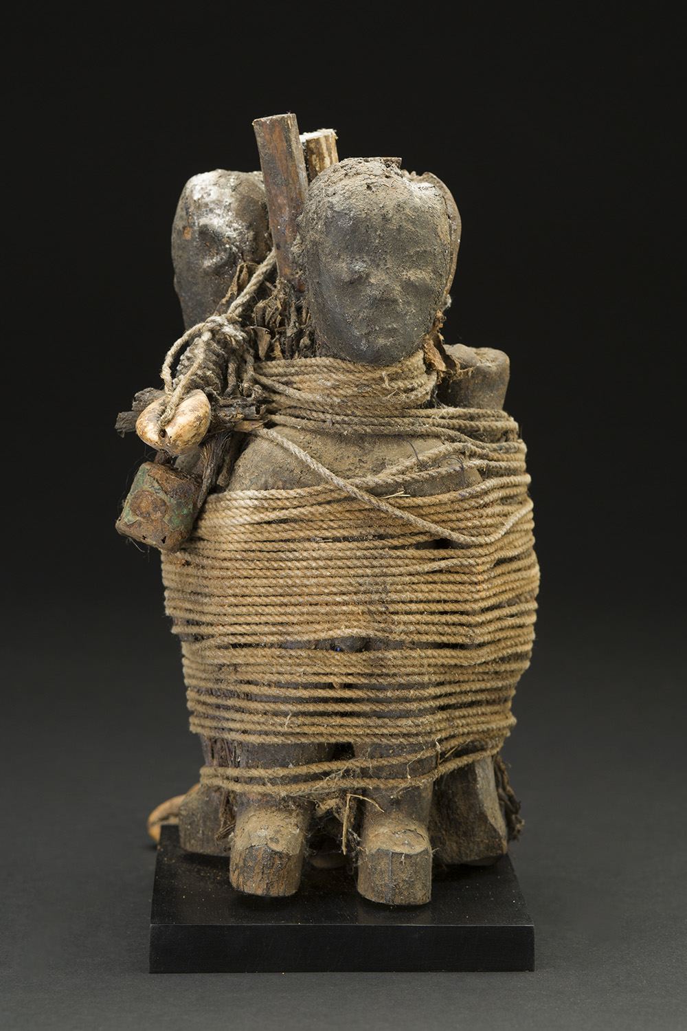  Africa    Vodun Sculpture - Ewe People - Togo  , Mid. 20th C.&nbsp; Wood, string, bone, shells, nails, padlocks, pigment, iron, feathers, patina, and sacrificial materials 8 x 5.25 x 4 inches 20.3 x 13.3 x 10.2 cm Af 317 