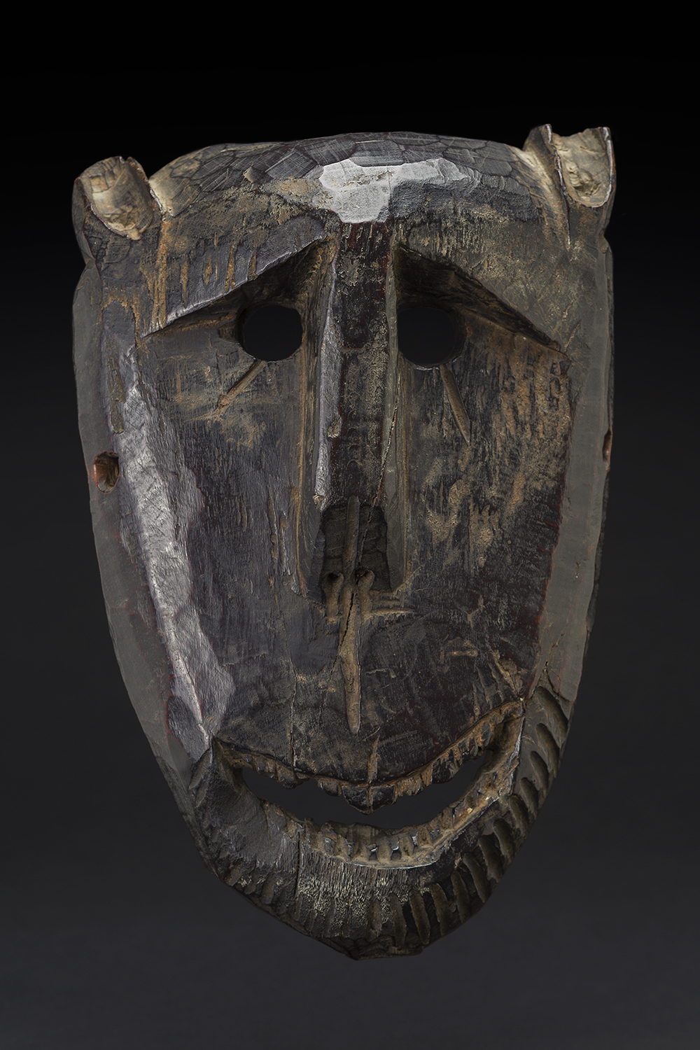   Masks    Nepal  , circa 19th C. Wood 12 x 7.5 x 3 inches 30.5 x 19.1 x 7.6 cm M 195s 