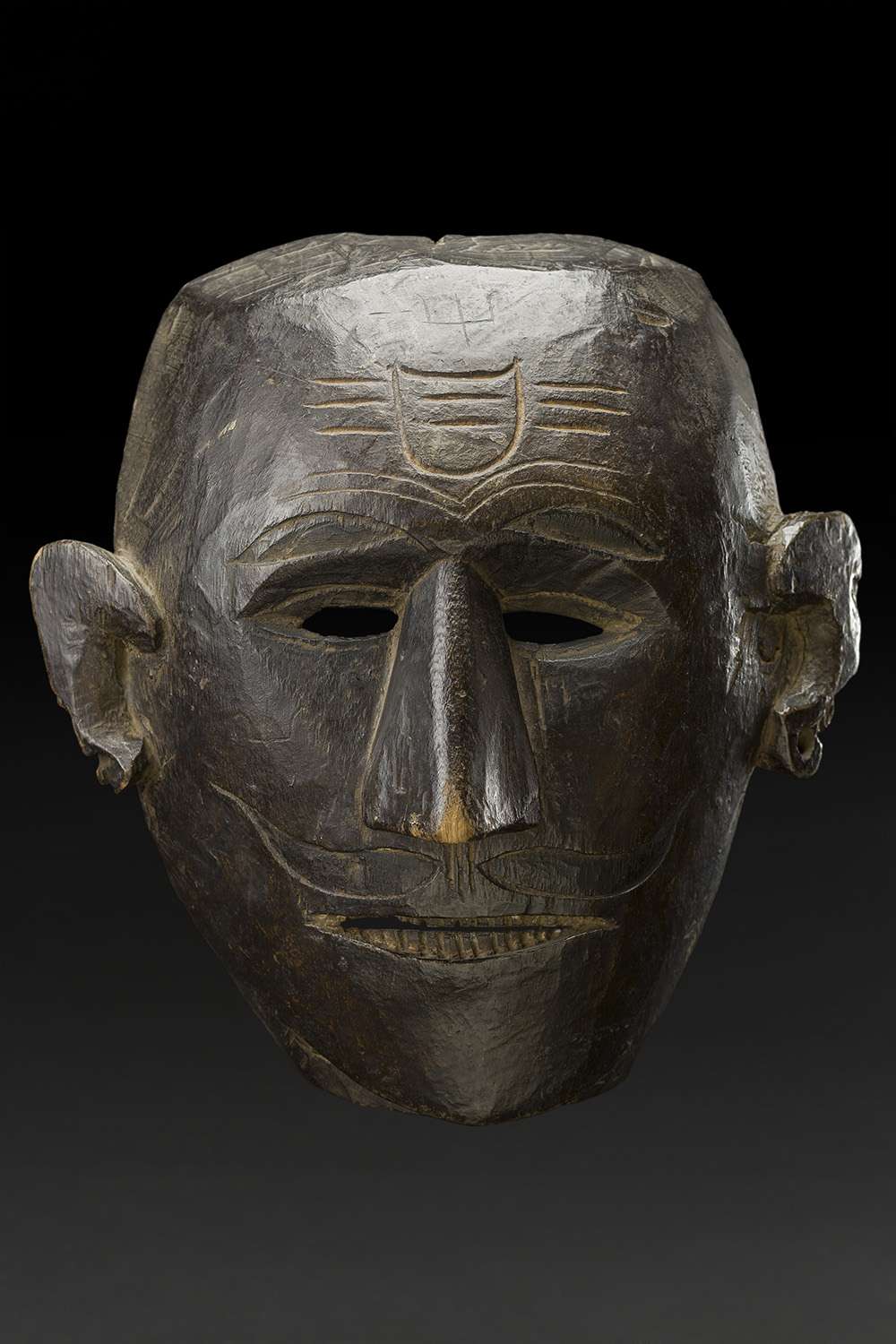   Masks    Nepal  , Early 20th C. Wood 11.5 x 10.4 x 5.5 inches 29.2 x 26.4 x 14 cm M 220s 