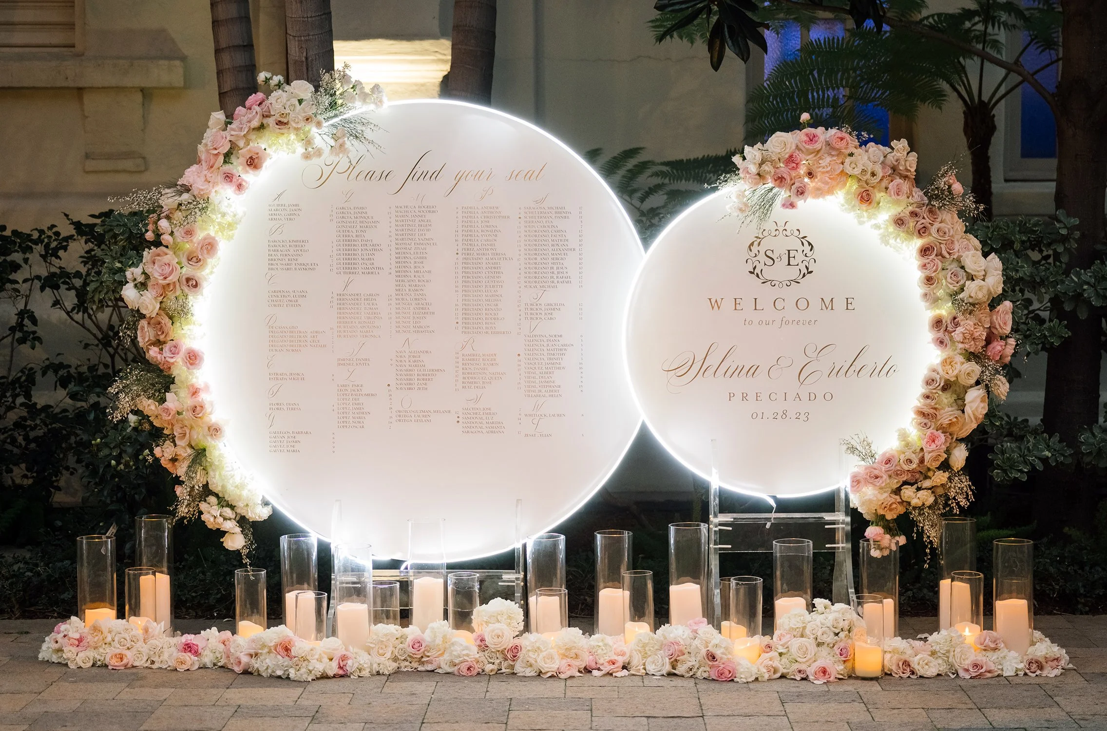 Wedding Welcome Sign and Seating Chart with floral arrangement and candle decor