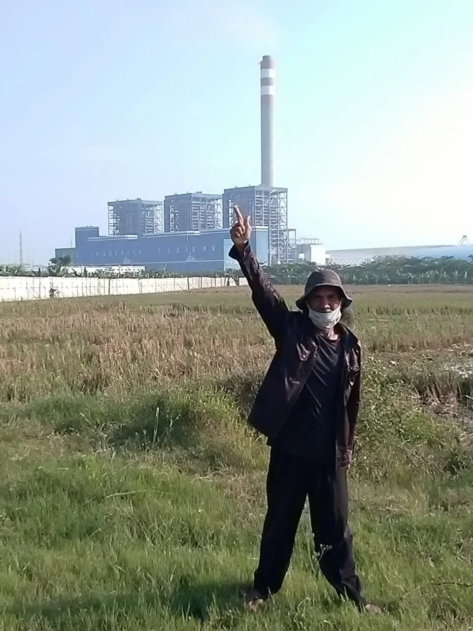 Domo in front of the First Coal Power Plant Indramayu in Mekarsari Village (June 2020). Photo credits: JatAyu