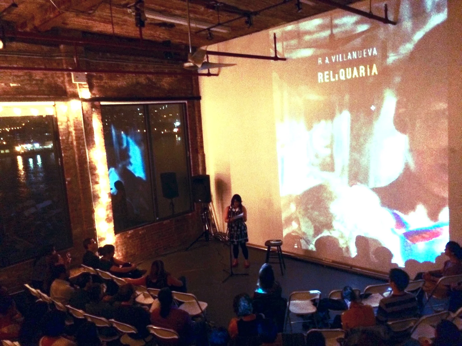 Celebrating the launch of R. A. Villanueva's debut collection, Reliquaria , by reading his poem, "Swarm," and my poem, "Swarm." Photo courtesy of R. A. Villanueva.