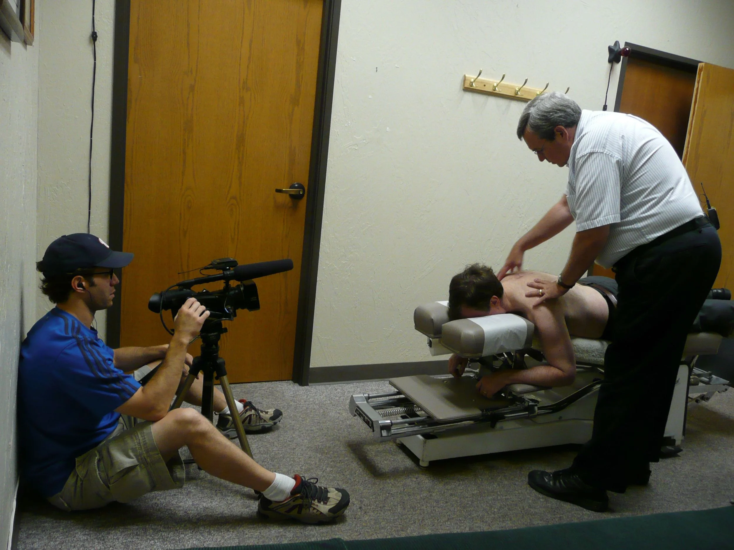 Sam films Dennis Doan, DO adjusting Jim