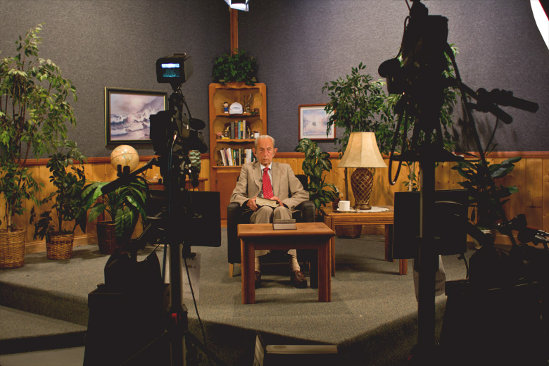 Camping prepares for Open Forum, a live talk-telephone program broadcast daily on radio and TV.