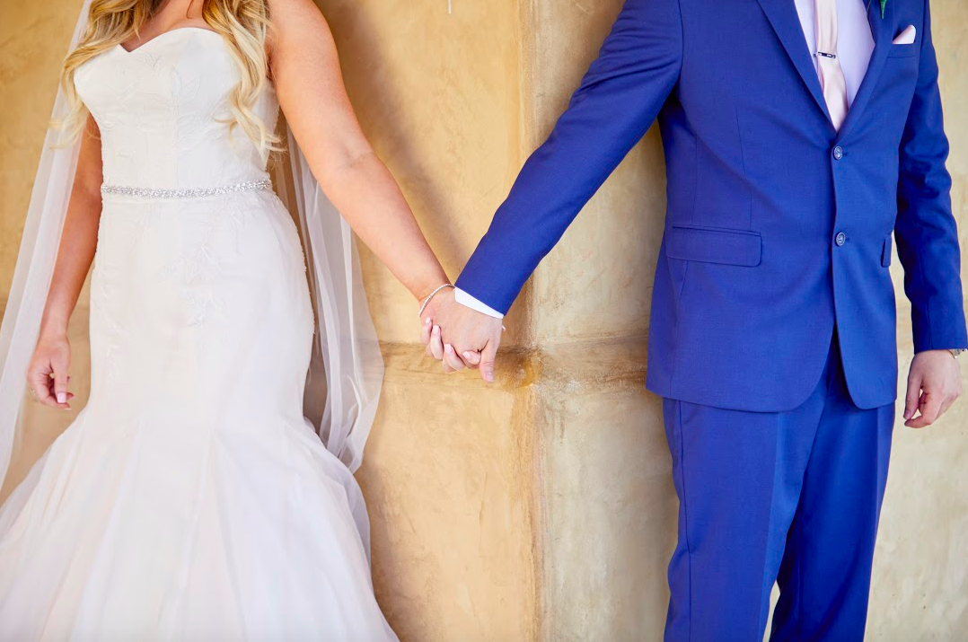 We didn't do a first look, but we did hold hands and talk together (without seeing each other!) before we walked down the aisle. 