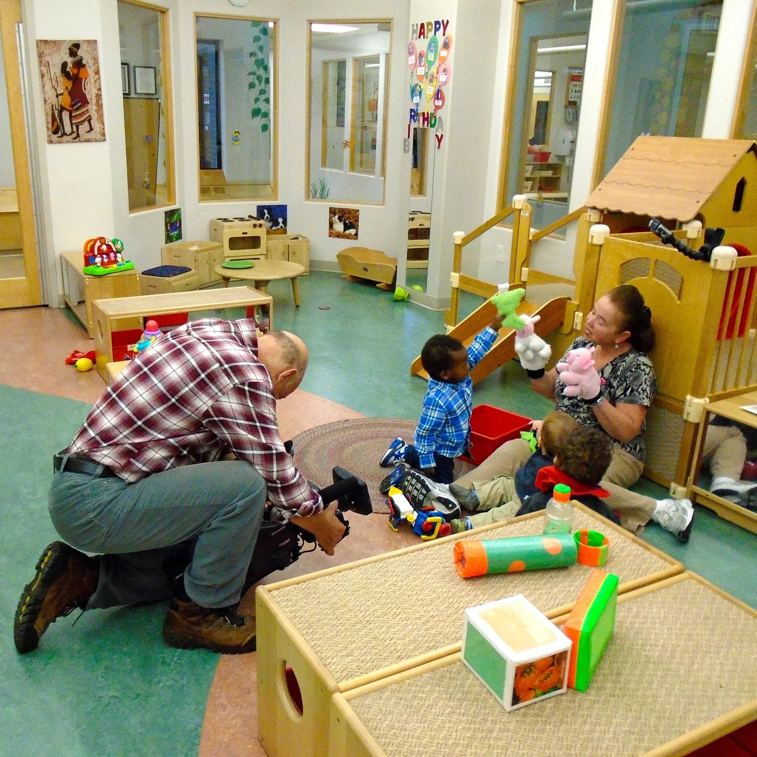 Singing songs and playing with puppets!