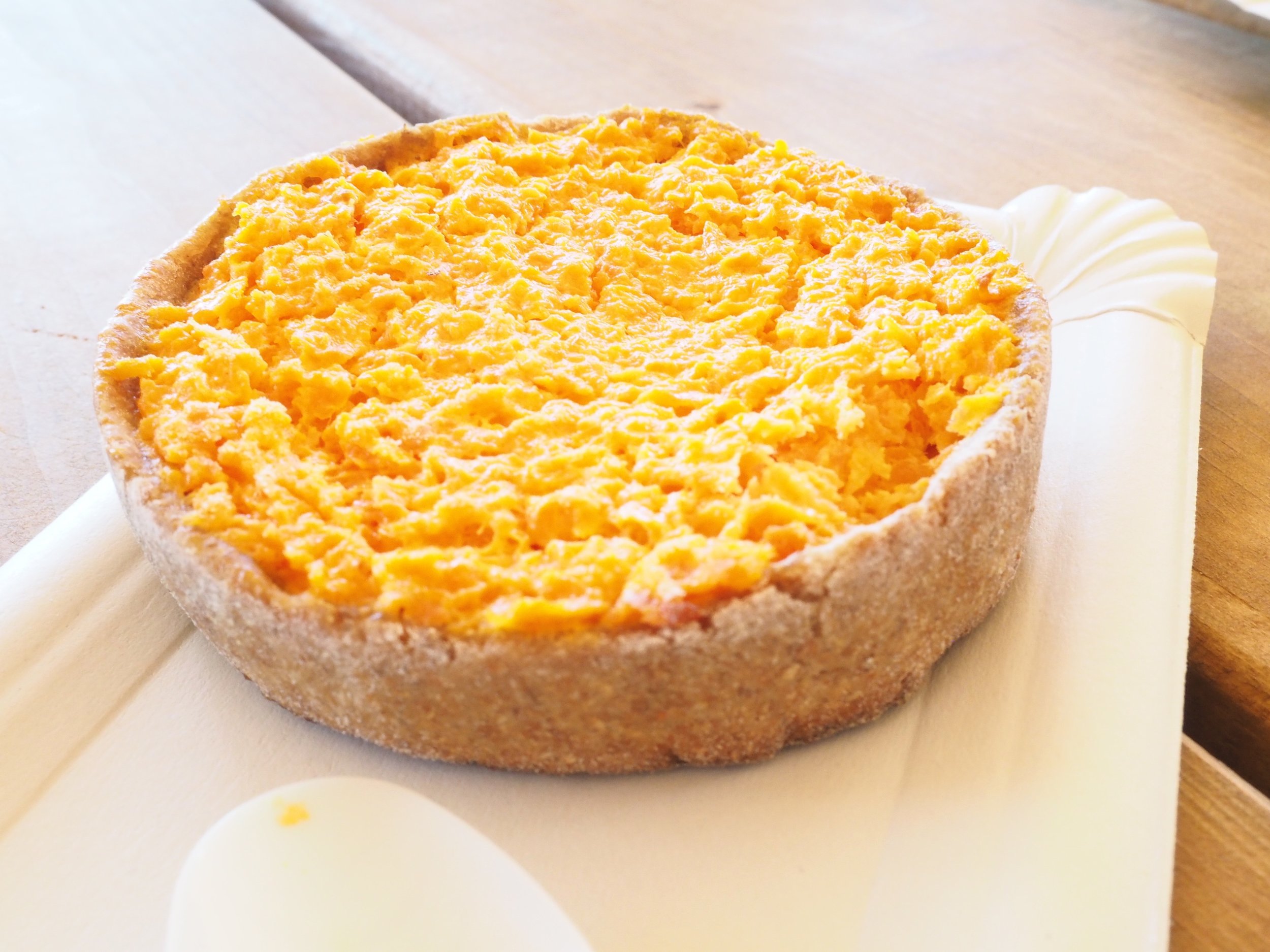 Sklandrausis: A vegetable tart consisting of carrot, potato, honey, and a custard-like sauce in a rye shell. 