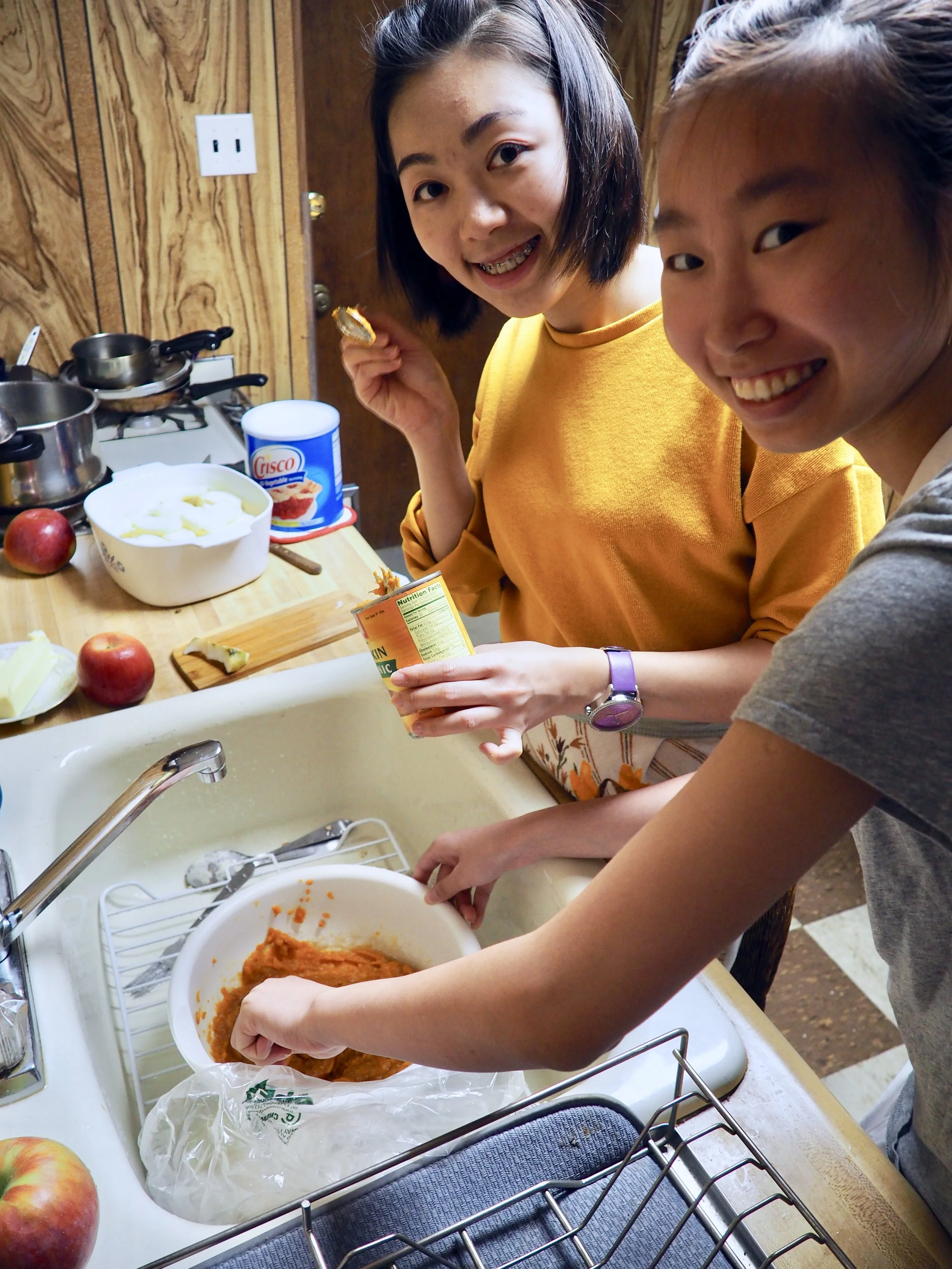 Julia (left) and Tiffany (right) questioning the orange goo that is "pumpkin puree" 