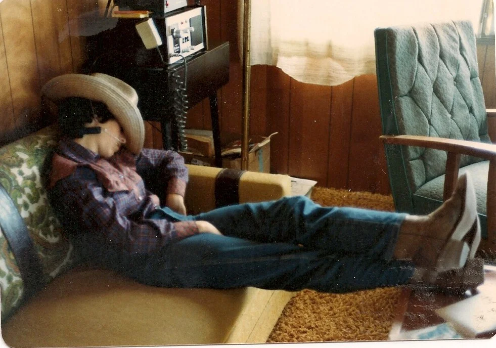 Mom catching some sleep (not on the bus) after a long day of working cattle--1983