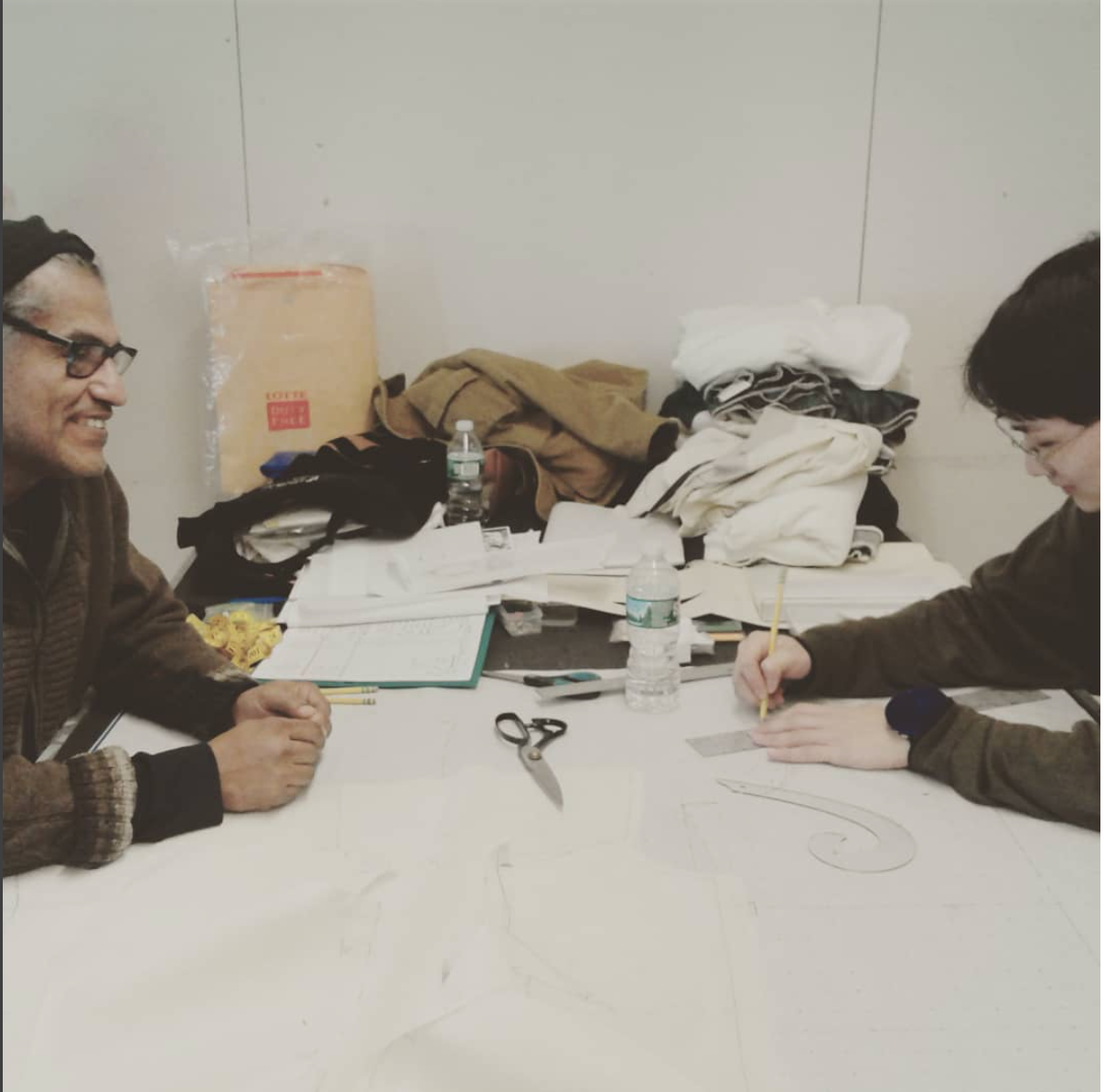 Mario and another FIT Student working on pattern drafting