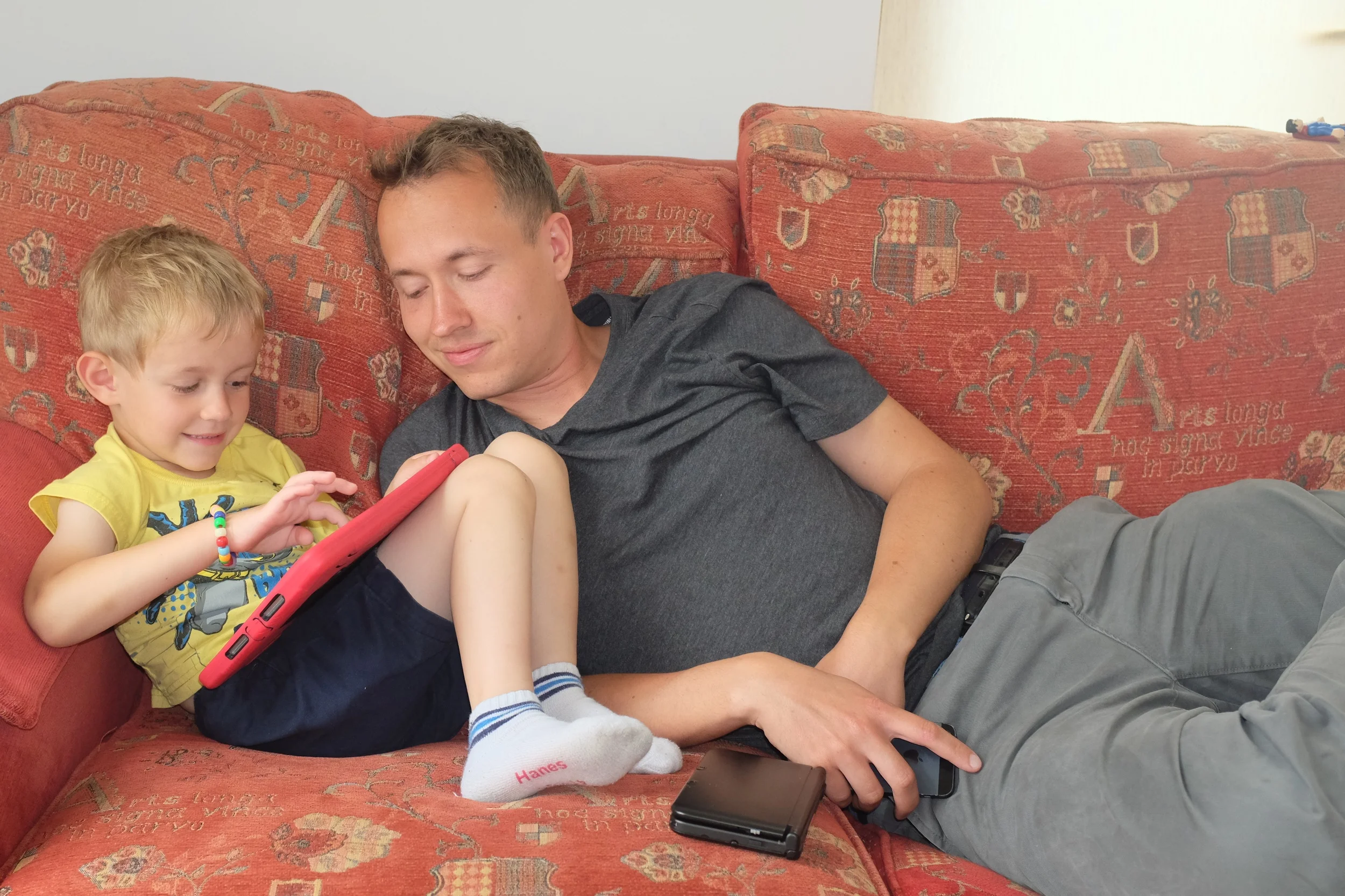 Kian playing Lego Star Wars on the iPad while daddy gives him helpful hints