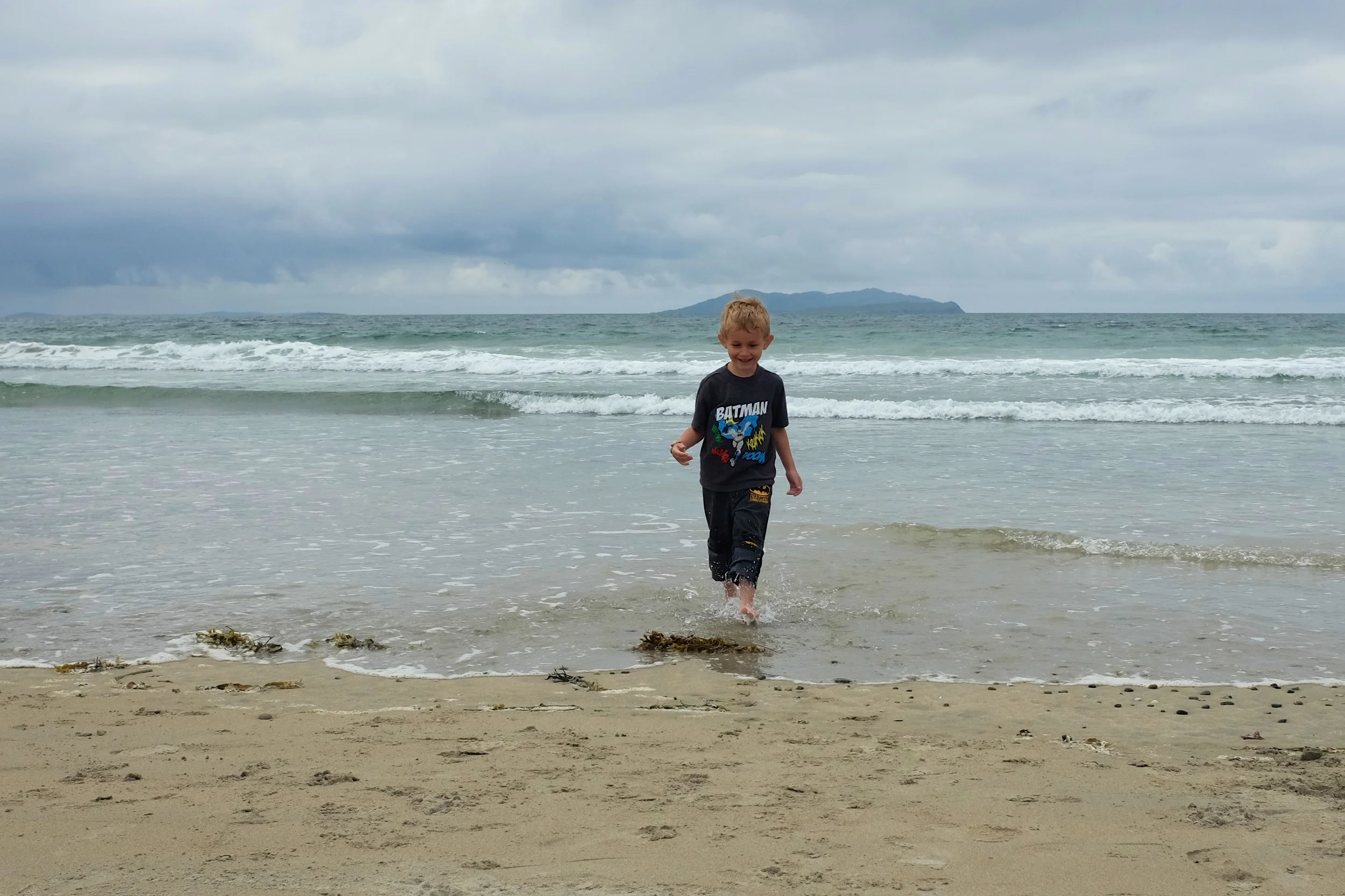 Kian running away from said wave that got his pants almost all wet