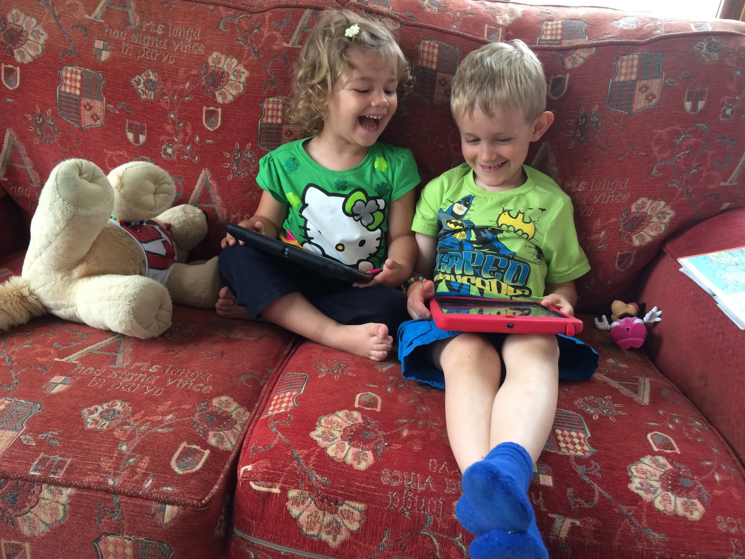 Kian and Hannah playing on their iPads