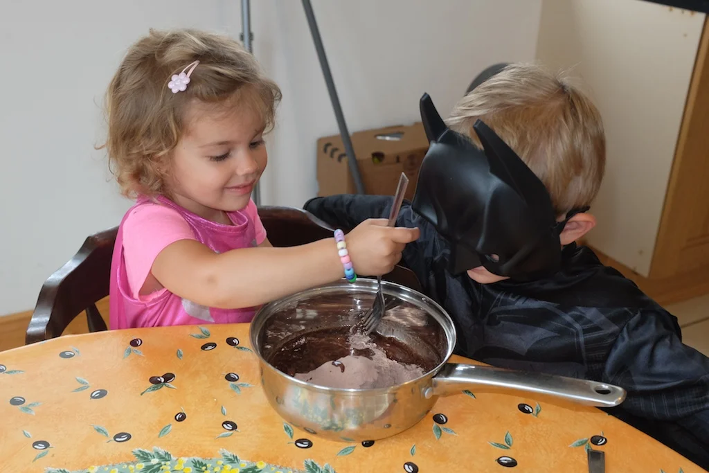 Batgirl working on the brownie mix