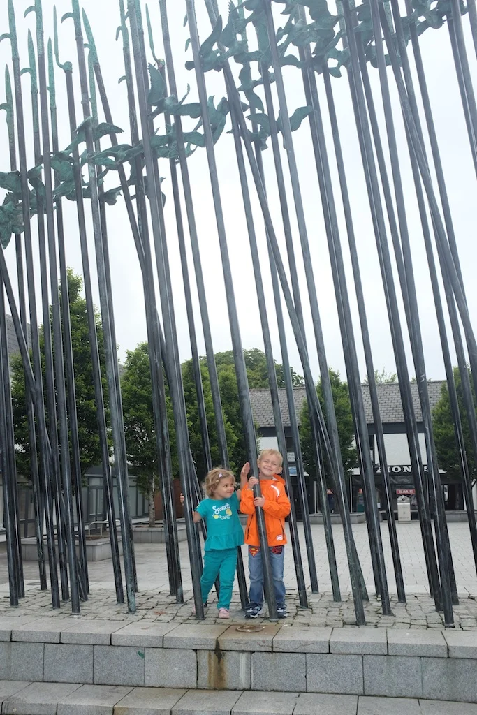 Kian and Hannah posed with the "Bronze and Stainless Steel artwork, evoking the 1798 rebellion and in particular the episode known as the "The Races of Castlebar". The cloud of doves signifies the reconciliation after conflict."