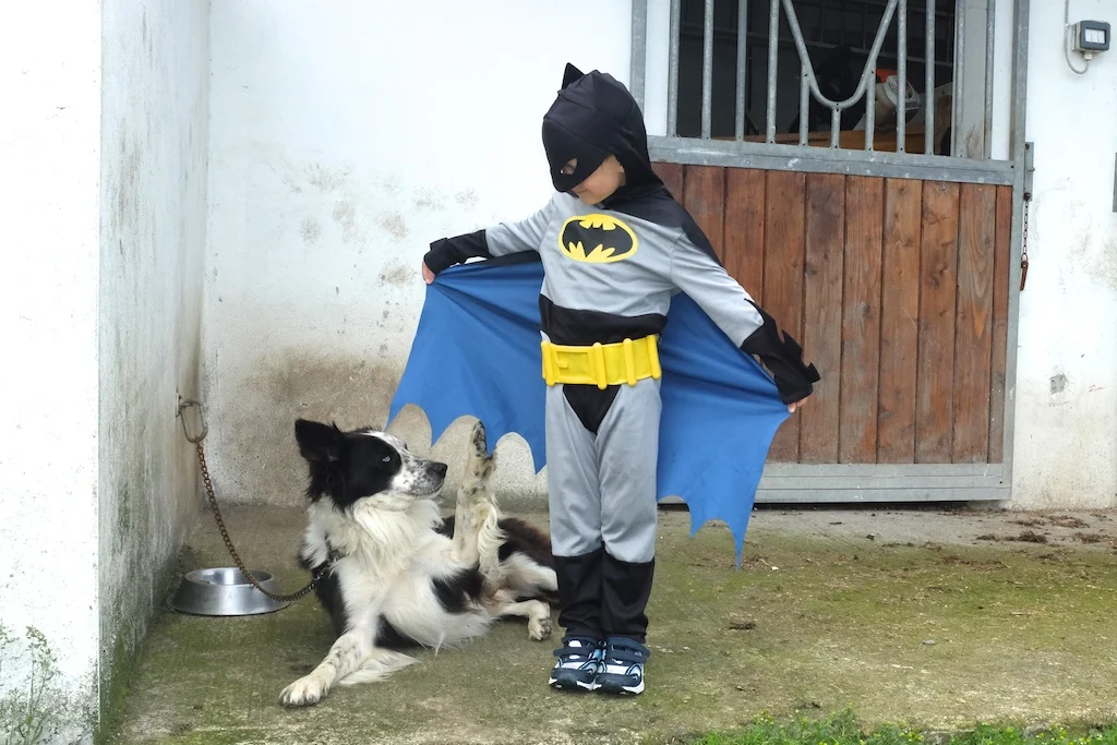 Sam checking out Batman's cape