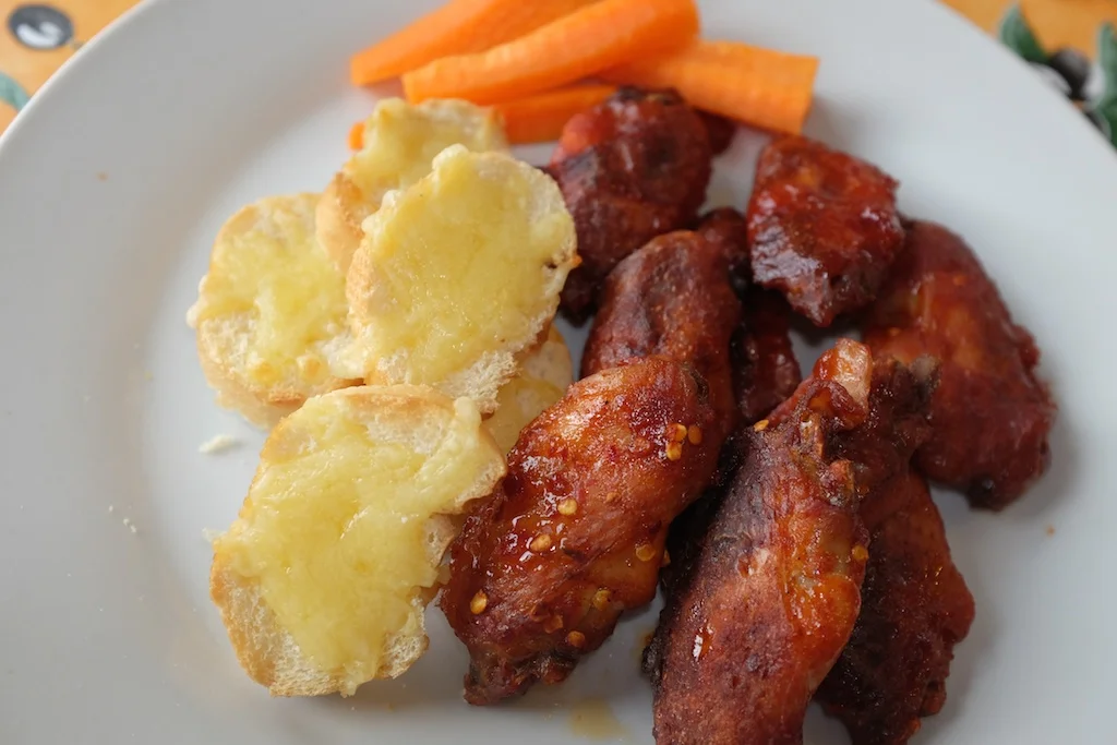 Chicken wings, cheesy bread, carrot sticks