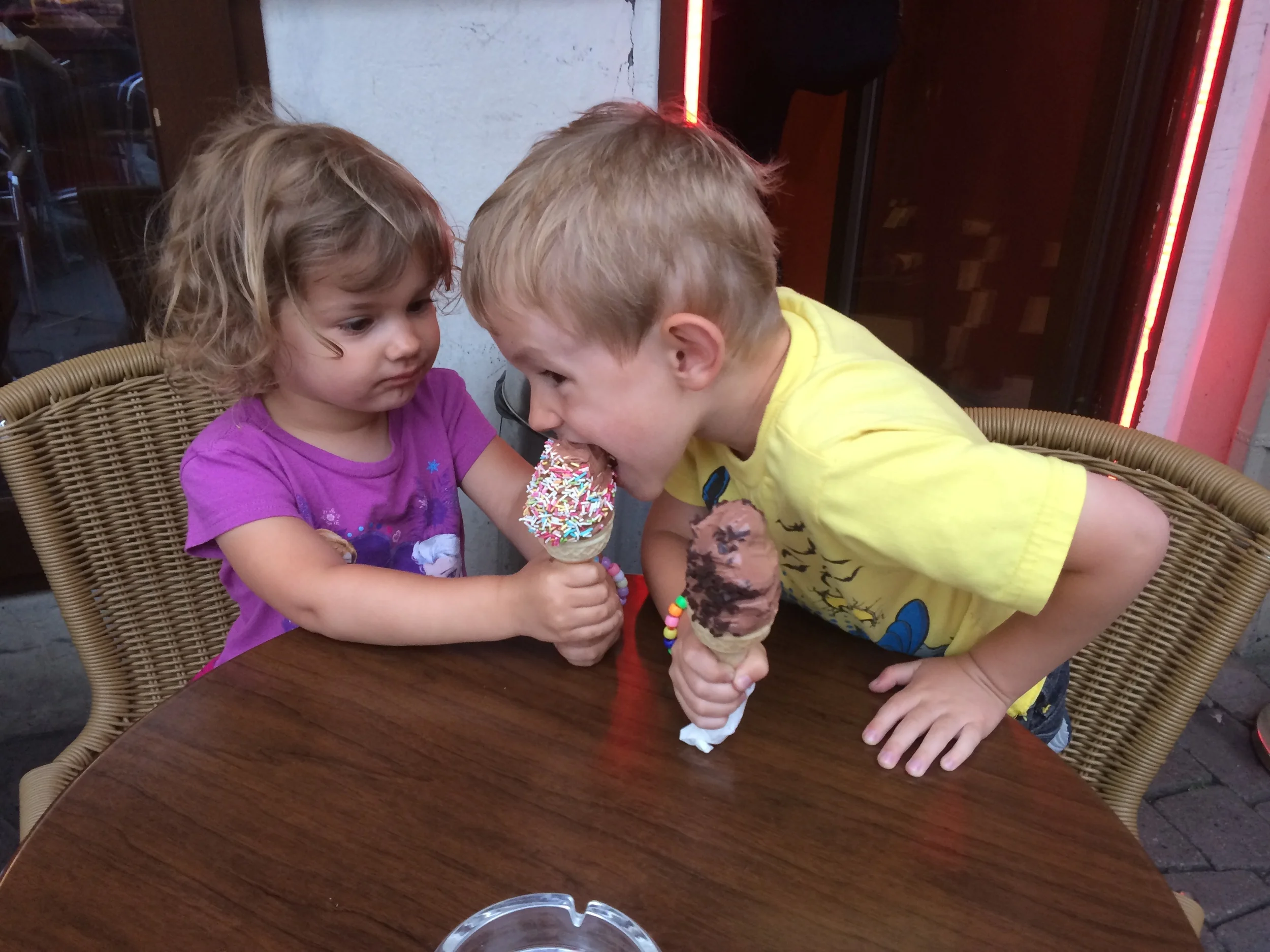 Kian trying Hannah's ice cream since they had different sprinkles