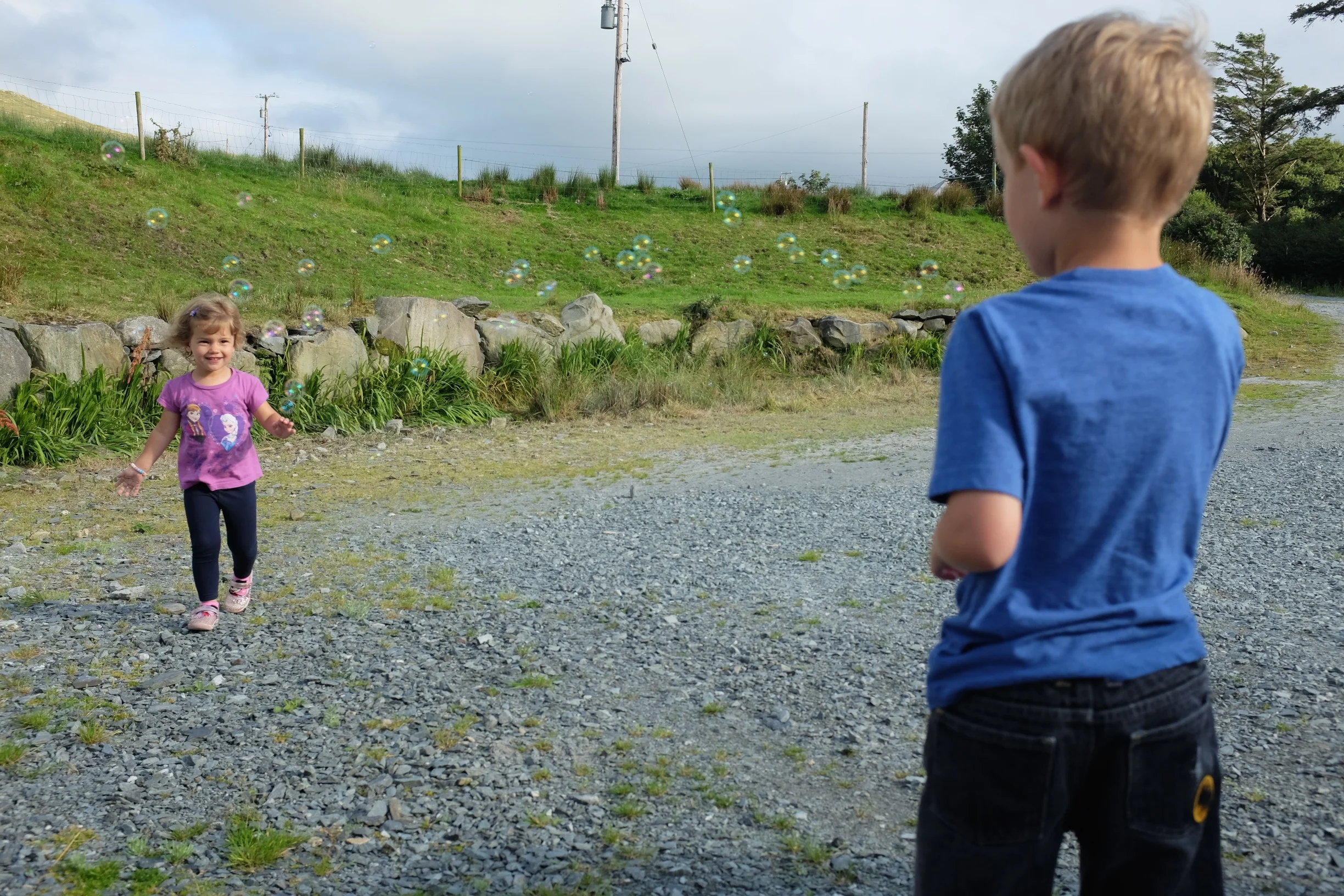 Hannah chasing after the bubbles